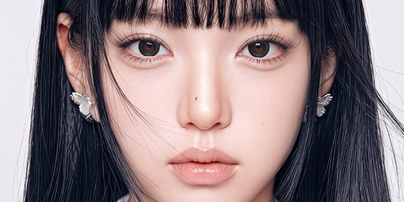 model with round doe eyes wearing big diameter colored contacts